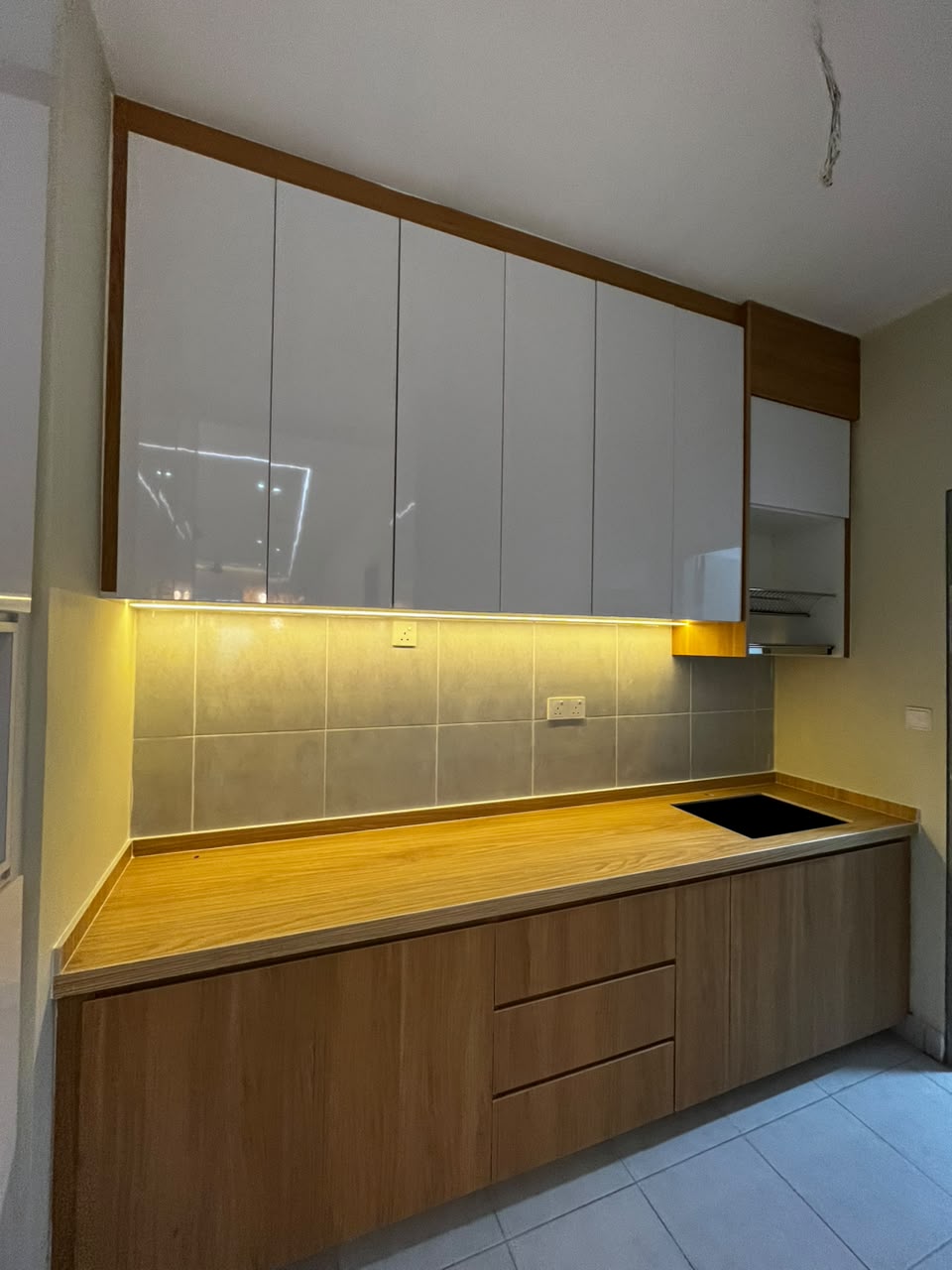 Wood tone kitchen cabinet by EUKA Living